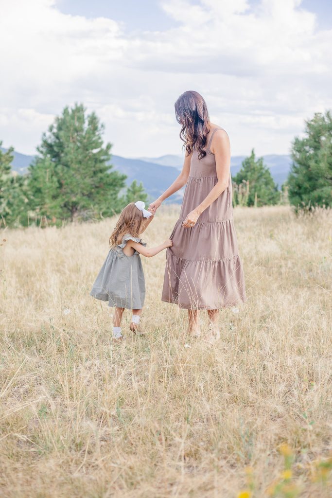 Stone Oak Counselors Home 21 Stone Oak Counselors woman dancing with child outside